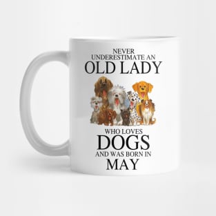 Never Underestimate An Old Lady Who Loves Dogs And Was Born In May Who Loves Dogs And Was Born In May Mug